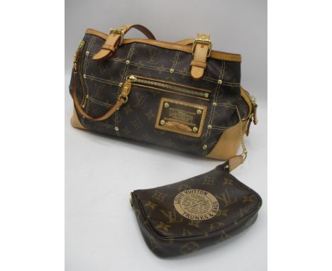 Louis Vuitton-A multi zip, brown monogram bag V11007 with detachable purse on gold tone chain FL1097, both manufactured in 20