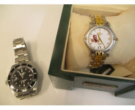 An Appella metal cased quartz wrist watch with a portrait of Colonel Gaddafi to the dial and another automatic wrist watchLoc