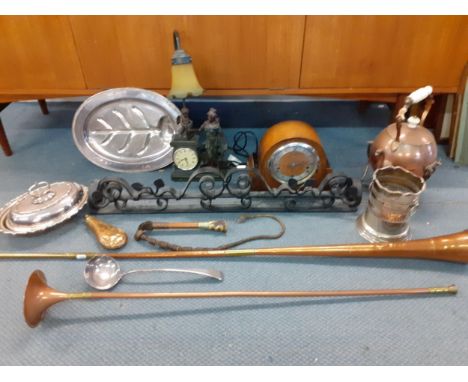 A wrought iron fire surround together with a Bravingtons oak cased mantel clock, a late 20th century figural table lamp with 