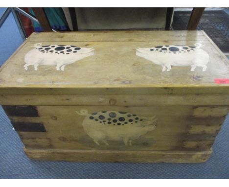 A small painted pine trunk A/F with images of pigs, 35 x 68 x 38cmCondition: several metal corner brackets are missingLocatio
