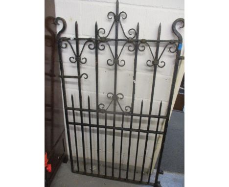 A wrought iron black pained gate 