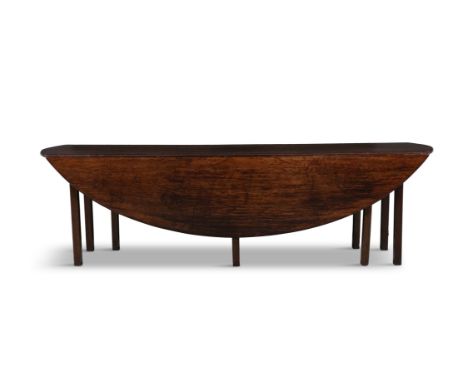 A 19TH CENTURY MAHOGANY HUNT TABLEextending to oval shape, the solid panel top and leaves moulded edge, on squared gate-leg s