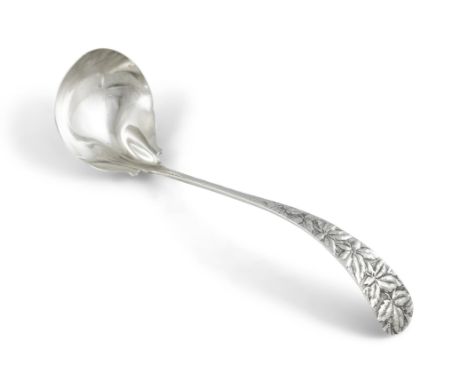 A LATE 19TH CENTURY AMERICAN STERLING SILVER SOUP LADLE, the curved tapering handle with repousse chased and engraved foliate