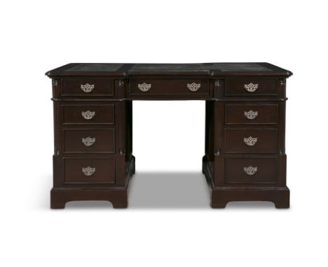 A LAQUERED PARTNERS DESK, 20TH CENTURYthe shaped rectangular top inset with three faux leather scrivers, above three frieze d
