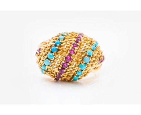 A VINTAGE RUBY AND TURQUOISE BOMBE RINGSet with three rows of rubies and two rows of turquoise, in 18ct yellow gold, ring siz