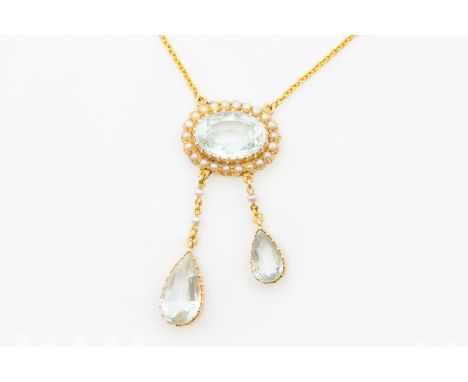 AN EDWARDIAN AQUAMARINE AND SEED PEARL PENDANTThe pendant comprising an oval aquamarine in a halo of seed pearls, with two ar