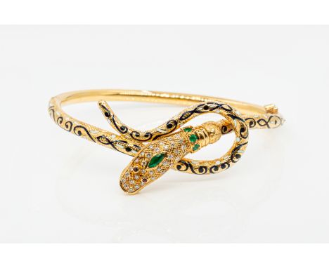 A GEMSET AND ENAMEL SNAKE BRACELETThe head set with diamonds, emeralds and rubies, the body detailed with black and white ena