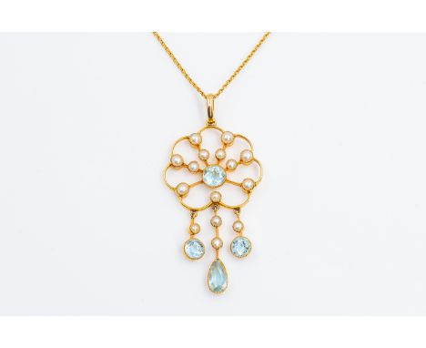 AN EDWARDIAN AQUAMARINE AND PEARL PENDANTSet with aquamarines and seed pearls in an fine gold surround, stamped 15CT, on a go