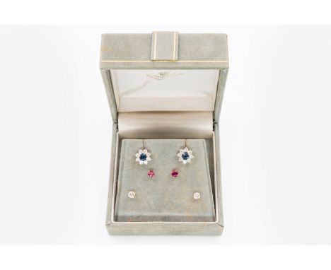 A PAIR OF INTERCHANGABLE EARRINGS, SAPPHIRE, RUBY AND DIAMONDThe earrings in a cluster style with interchangeable centers, in