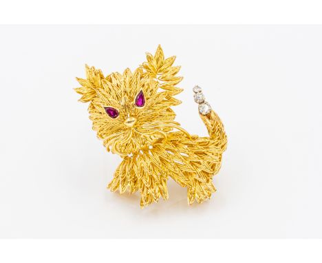 CARTIER - A RUBY AND DIAMOND CAT BROOCHThe cat brooch is set with two pear shaped ruby eyes and three round brilliant cut dia