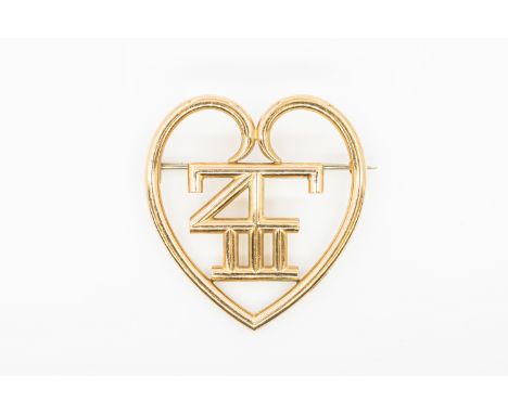 CARTIER - A GOLD BROOCHOf symbolic form, in 9ct yellow gold, and with maker's mark J.C, weight 12.5 grams, measures approx 3.