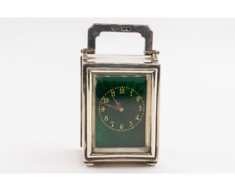 A SILVER AND GREEN ENAMELLED TRAVELLING CARRIAGE CLOCK TIMEPIECEThe green enamelled dial with gilt Arabic numerals, the case 