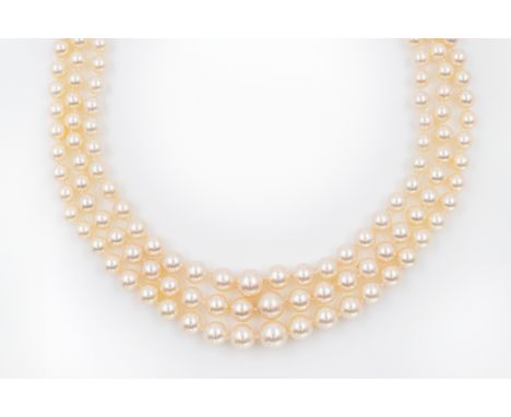 A THREE ROW PEARL NECKLACE WITH DIAMOND CLASPComprising three rows of graduated cultured pearls, with a diamond set clasp in 
