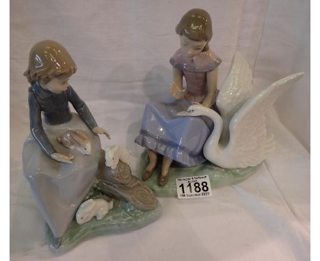 Two Nao figurines, largest H: 18 cm. Not available for in-house P&amp;P 