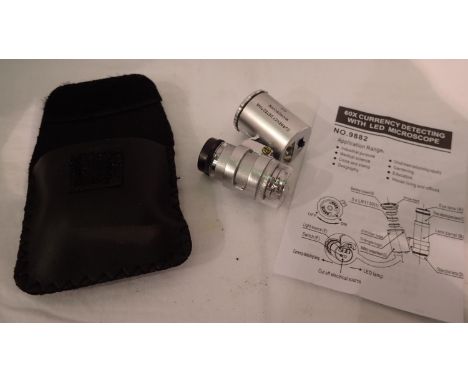 Cased 60x magnification currency/jewellery loupe with LED light and instructions. P&amp;P Group 1 (£14+VAT for the first lot 