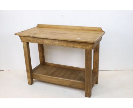 Good pine bakery worktable with pot shelf below 