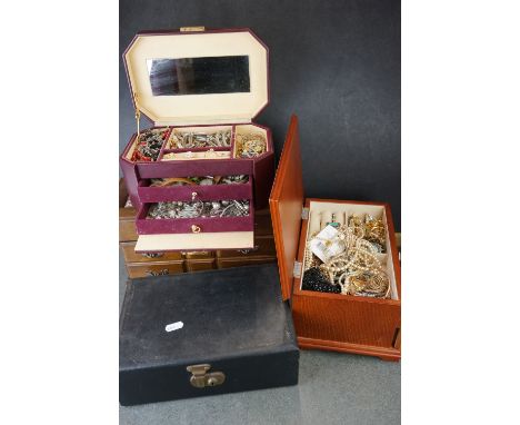 A large collection of vintage and contemporary costume jewellery contained within four boxes. 