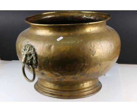 Large Brass Globular Jardiniere / Planter with twin lion mask ringed handles, 33cms high 