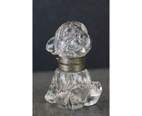 A vintage glass inkwell in the form of Bonzo the dog. 