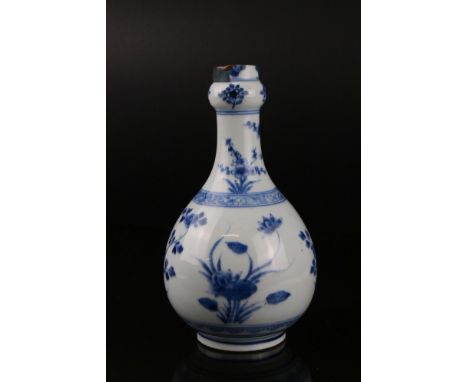 Chinese Blue and White Vase of Baluster form decorated with floral sprays, Kangxi period, 23cms high 