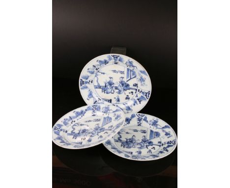 Three Chinese Blue and White Plates, Kangxi period, decorated with figures, 23cms diameter 
