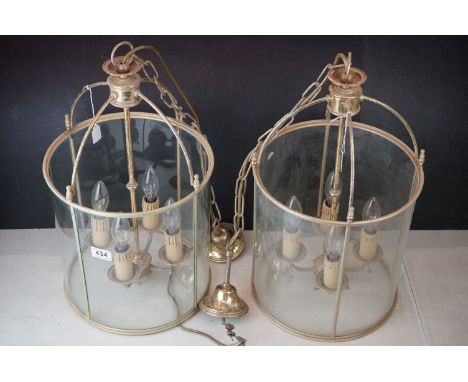Pair of Georgian style Gilt Metal and Glass Cylindrical Hall Lanterns, each with four branch light fitting, 55cms high 