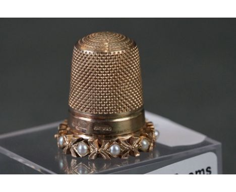 A fully hallmarked 9ct gold and seed pearl set thimble. 
