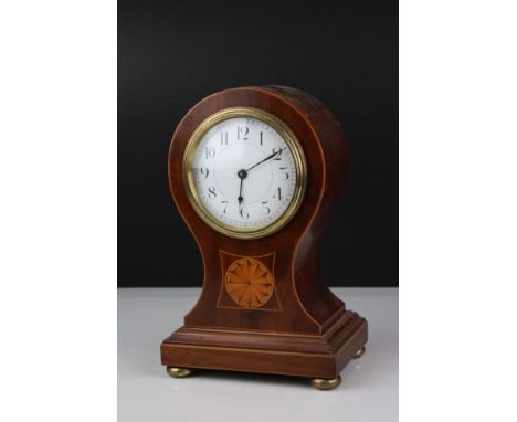 Edwardian Mahogany Inlaid Waisted Mantle Clock, the white enamel face with Arabic numerals, raised on four brass feet, 22.5cm