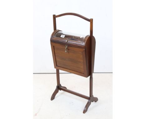 Early 20th century Mahogany Sewing Cabinet with domed glass hinged lid to top opening to a fitted interior, above a fall fron