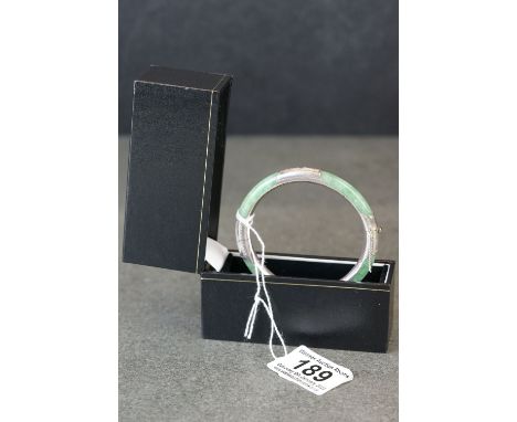 A 925 silver mounted jade bangle. 