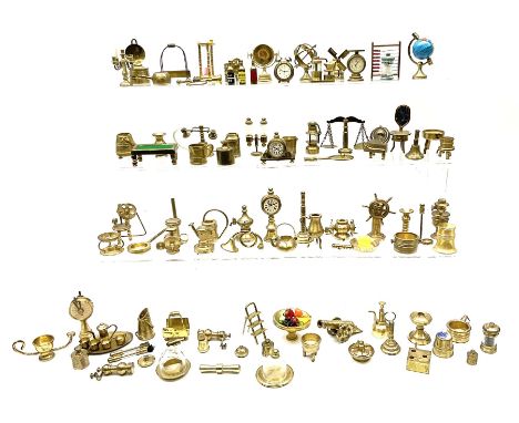 Over one-hundred various scale miniature brass ornaments suitable for decorating doll's houses including assorted lamps, fire