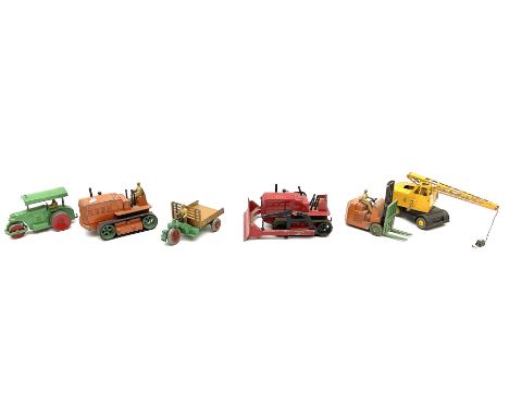 Dinky - six unboxed and playworn die-cast commercial vehicles comprising Blaw Knox Bulldozer, Heavy Tractor with driver, Cole
