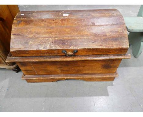 A stripped pine dome top trunk