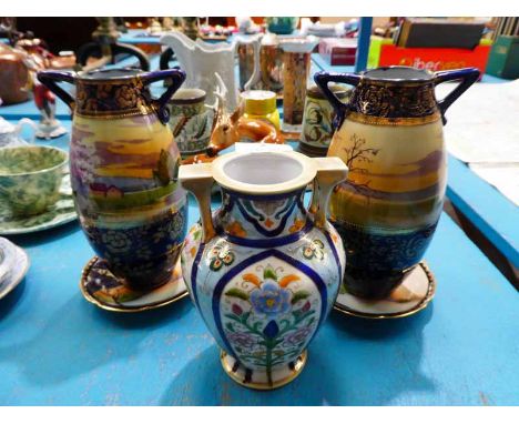 A pair of Nointake Vases with stands and a single Noritake Vase