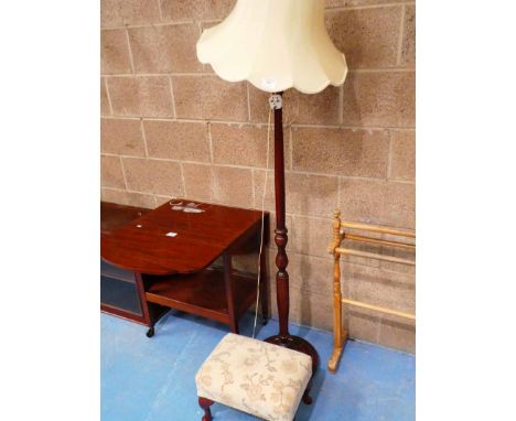 A Standard lamp and a footstool