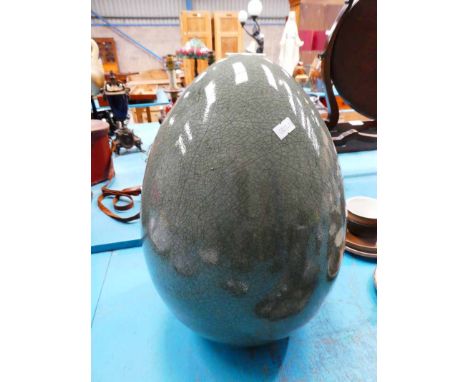A large crackle glaze ceramic egg ornament
