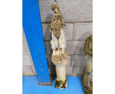 A Stoneware garden statue shepherdess on support