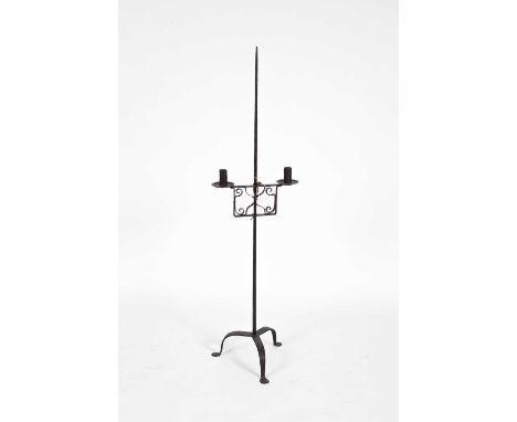 An 18th Century adjustable iron two-branch candle stand on a tripod base, 133cm high