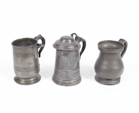 A lidded pewter tankard, circa 1820, with double-scroll handle, a pewter jug circa 1820 with double-scroll handle and a pewte