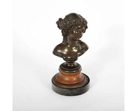 French School late 19th Century, bronze bust of a young lady, on a turned wooden plinth, circular marble base, approximately 