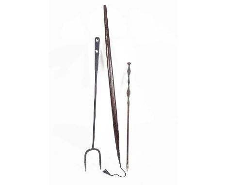 An iron log fork, 115cm long, an iron poker, 94cm long and a long wooden handled candle snuffer, 148cm long (3)