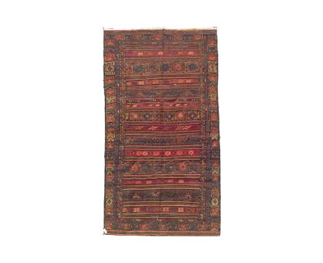 A Soumakh carpet East Caucasus, circa 1900-1920, the field of polychrome striped bands of geometric motifs, 295cm x 152cm