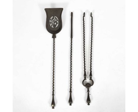 A set of three cast iron fire tools, 20th Century, with spiral handles, 72cm long