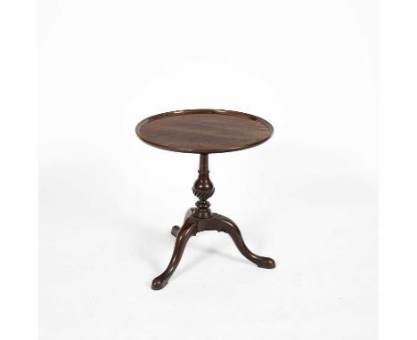 A mahogany tripod table, the tilt top on spirally reeded knopped column, 52cm diameter, 47cm high