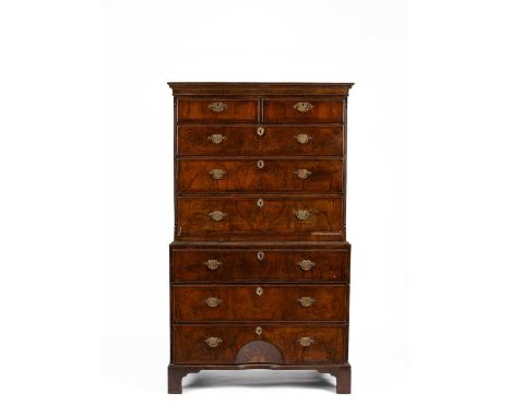 A George II walnut and featherbanded chest on chest, the bottom drawer with concave inlaid starburst,105cm wide, 55cm deep, 1