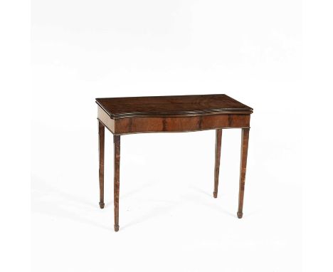 A George III style mahogany fold-over card table, with serpentine front on tapering legs, Maple &amp; Co label, 91cm wide, 49