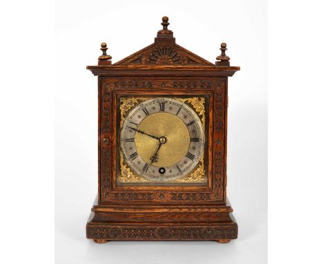 A Winterhalder and Hofmeier oak cased mantel clock, late 19th/ early 20th Century, carved decoration to case, brass and silve