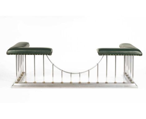 A contemporary club fender with green leather upholstery on a brushed steel frame, 185cm wide, 61cm deep, 53cm highInternal b