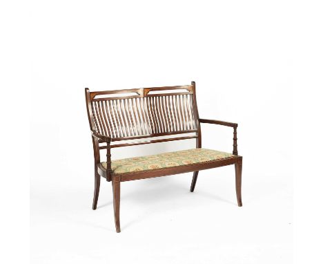 An Edwardian mahogany inlaid settee, with rail back, upholstered seat on splayed tapering supports, 110cm wide, 47cm deep, 92
