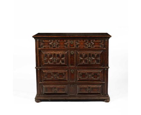 A James II oak chest of drawers, circa 1680, the four drawers each set with raised geometric mouldings on bun feet, 100.25cm 
